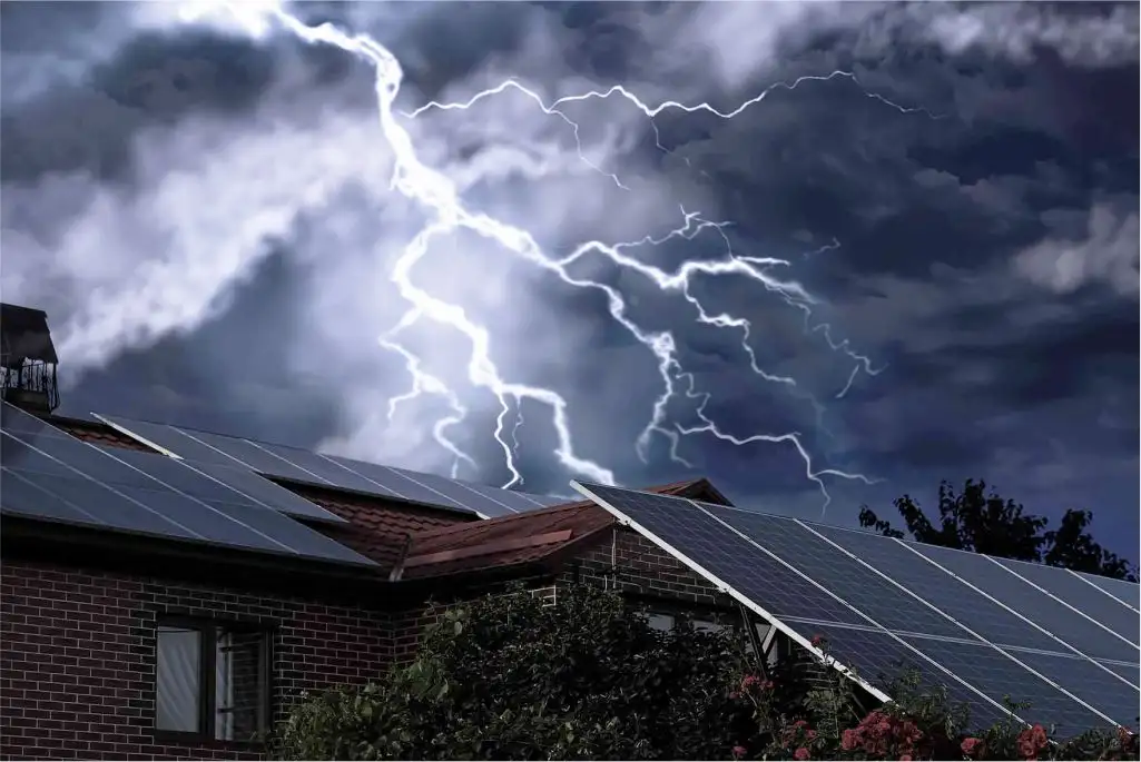 Solar panels on a house under a dark, stormy sky with lightning bolts
