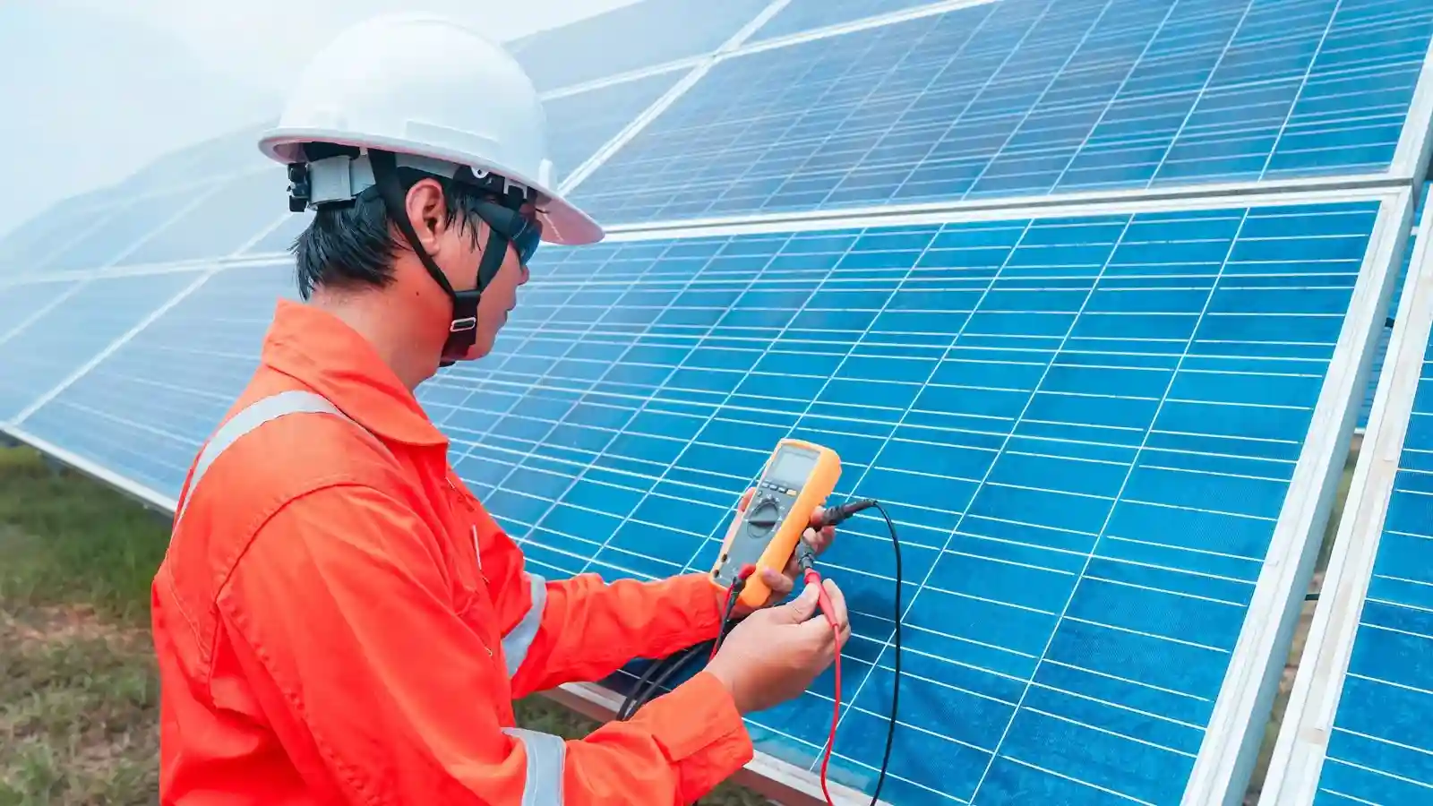 professional inspecting the solar panel wattage