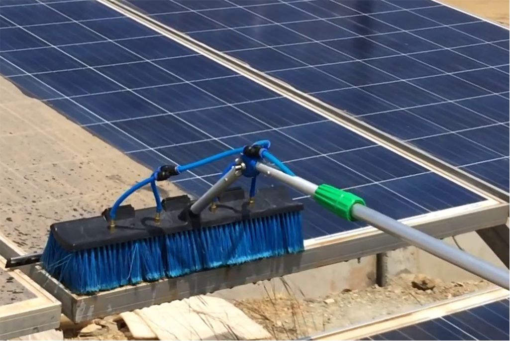 professionals cleaning the solar panels