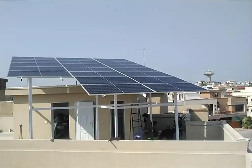engineer installing solar panels on house roof