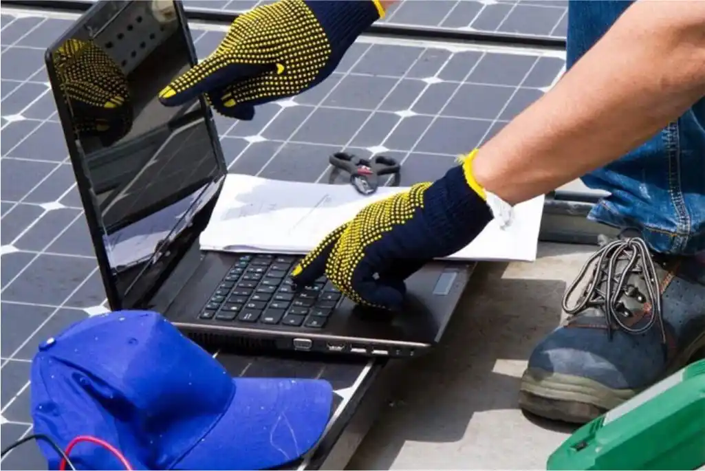 solar engineer inspecting solar panels